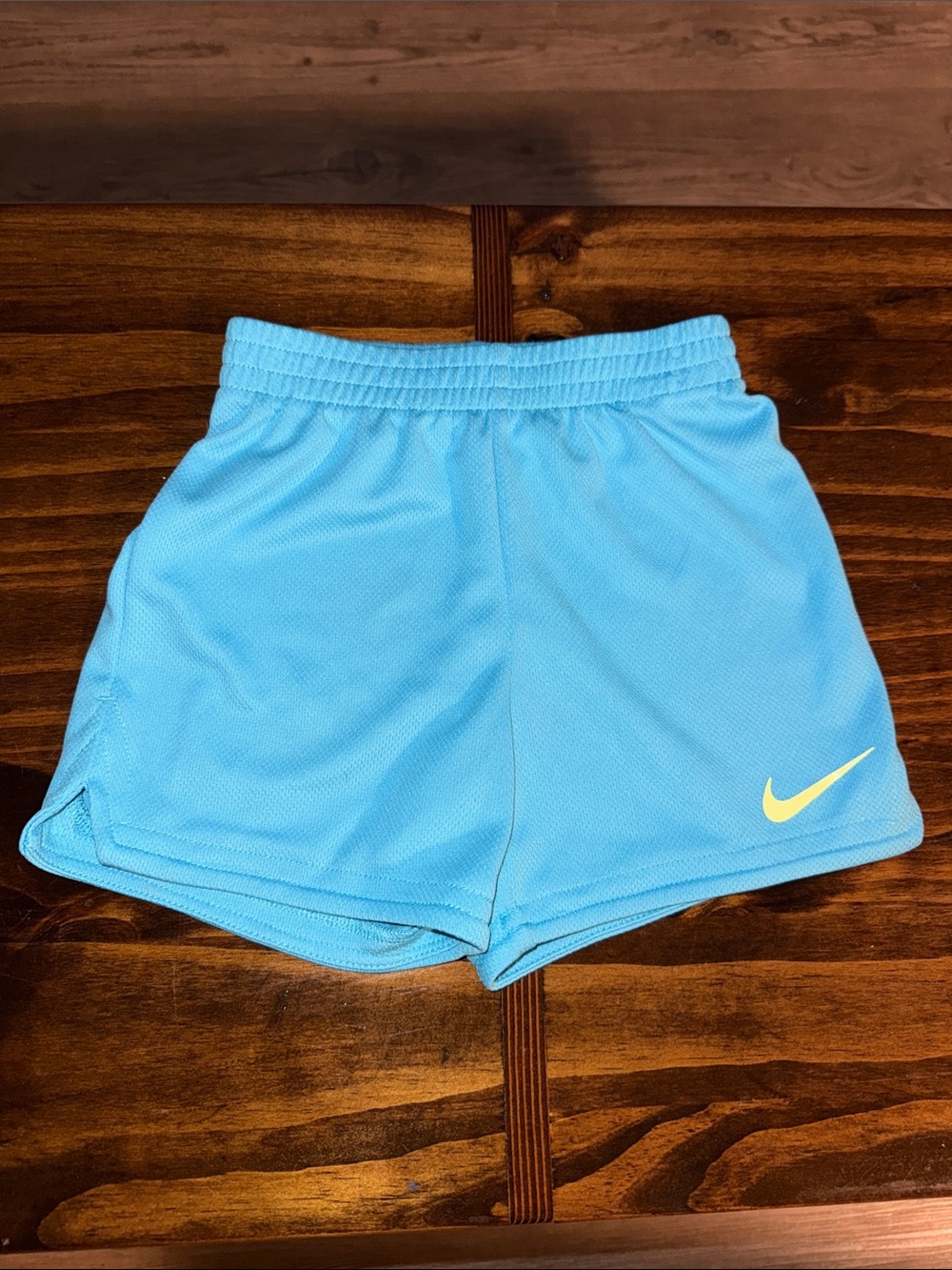 Nike Sky Blue Athletic Shorts with Yellow Swoosh